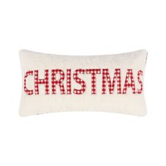 a red and white pillow with the word christmas on it