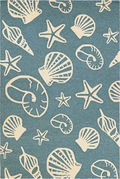 a blue rug with shells and starfishs on it