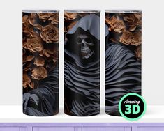 the front and back sides of two tumbles with an image of a skeleton in a black cloak surrounded by roses