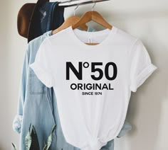 Are you or someone you know turning 50 soon? Celebrate this milestone birthday in style with our 50th shirt! This unique and eye-catching shirt is the perfect gift for anyone reaching their half-century mark, or a great addition to any 50th birthday party.  Sizing  ✺ Sizing is unisex  ✺ For adults, size runs like men's, though not overly large. Most women find their typical size works best, since they are meant to fit a touch loose and go up 1 or 2 sizes if you want the oversized look. ✺ Size gu 50th Birthday Tees For Women, 60th Birthday Tshirt, 40th Birthday Shirts Women, 50th Birthday Party Gifts, 50th Birthday Tshirts, 1984 Shirt, Tee Ideas, 40th Birthday Shirts, 50th Birthday Shirts