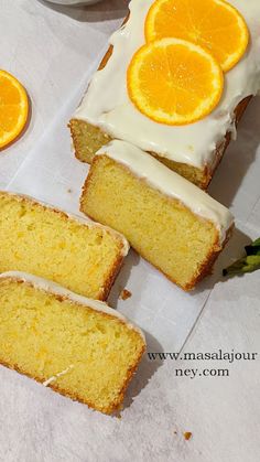 slices of orange pound cake with frosting and sliced oranges on the top one