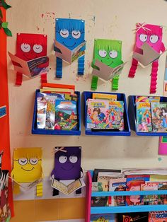 children's books are displayed on the wall in this school room with colorful decorations