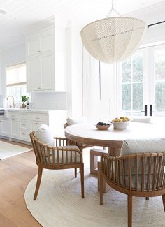 a dining room table and chairs in a kitchen