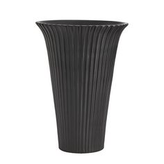 a tall black vase sitting on top of a table