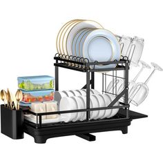 the dish rack is full of dishes and utensils, with plates in it