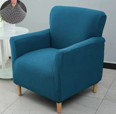 a blue chair sitting on top of a tile floor