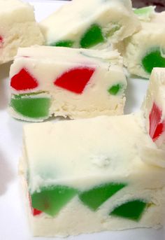 several pieces of white chocolate with green and red frosting