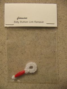 a red and white toothbrush sitting on top of a counter