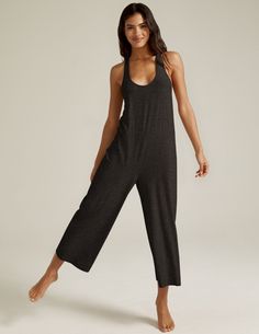 This light-as-air jumpsuit is your new comfort secret weapon, and the most versatile style in your closet: sleep in it. Lounge in it. Throw it on over your swimsuit. Or slip into it when the workday ends. It's relaxed fit and carefree make it an absolute essential. Designed and assembled in the USA Relaxed ﬁt Racerback detail Cropped length Uniquely created to flatter every shape Every style we produce is wear-tested on our in-house team to ensure the best fit in every size Flamboyant Natural Gym Clothes, Loose Yoga Outfit, Loose Workout Outfits, Massage Outfits For Women, Yoga Jumpsuit Outfit, Massage Therapist Outfit, Boho Yoga Outfit, Yoga Style Fashion, Yoga Onesie