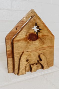 a small wooden house with an elephant and star on it