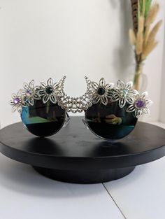 Elevate your festival look with Festival Sunglasses. Their versatile design complements any outfit, making them an essential accessory for both day and night festivities.  Adorned with intricate details like colourful beads, floral patterns, or natural elements.  If you have any questions or would like a headdress made on commission don't hesitate in contacting me! Visit us on Facebook - https://www.facebook.com/ Instagram - www.instagram.com/ PLEASE READ BEFORE PURCHASE Everyone's body is diffe Feather Crown, Festival Sunglasses, Colorful Feathers, Outfit Making, Festival Looks, Natural Elements, Day And Night, Floral Patterns, Headdress