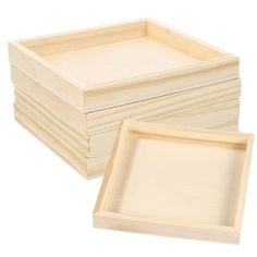 four wooden trays stacked on top of each other with one empty tray in the middle