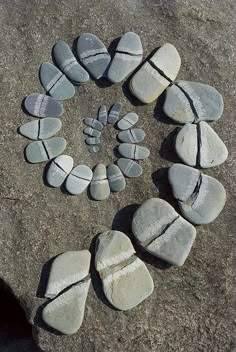 a circle made out of rocks sitting on top of a rock