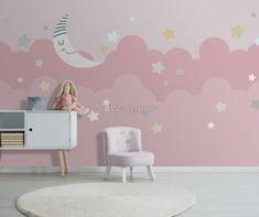 a child's room with stars and clouds painted on the wall, including a pink chair