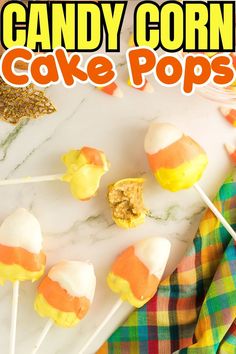 candy corn cake pops on a white marble counter top with the words candy corn cake pops above them