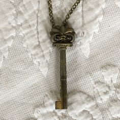 "Vintage Decorative Key on Antiqued Gold Brass Chain Necklace. Lovely Hanging Key Necklace. Lobster Claw Clasp. This necklace was just made and is in good shape. Size: Chain: 28\" Key Ornament: 3/4\" X 2 3/8\" For other jewelry and vintage items see: www.VeryVictorianStudio.etsy.com For sewing related items see my other shop: www.SewingRoomStore.etsy.com Thank you for looking!" Vintage Metal Jewelry With Keys Detail, Vintage Metal Jewelry With Keys, Vintage Metal Key Jewelry, Vintage Pendant Jewelry With Keys, Vintage Gold Jewelry With Keys, Vintage Gold Key Necklace, Vintage Gold Necklaces With Keys, Gold Brass Necklace With Keys, Key Ornament