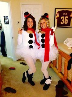 two women dressed up as snowmen posing for the camera