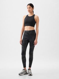 This legging is made with 79% recycled polyester.  Less waste in the world.  More great clothes for you.  Moisture Wicking helps keep your skin dry.  Stretch allows freedom of movement while providing superior shape retention.  Elongating flatlock contouring seams create smooth lines and help prevent chafing.  Smooth, flat, wide waistband.  Pocket at side.  High waisted.  Fitted silhouette. Brand Collaboration, Gender Equality, Support People, Gap Fit, Black Camo, Freedom Of Movement, Smooth Lines, Fitted Silhouette, Wide Waistband