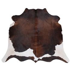 a brown and white cowhide rug on a white background