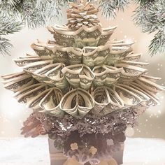 an origami christmas tree made out of money