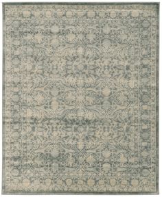 a rug with an ornate design in grey and beige colors on a white background,