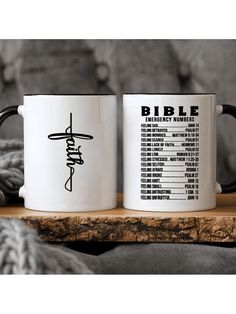 two coffee mugs sitting on top of a wooden table