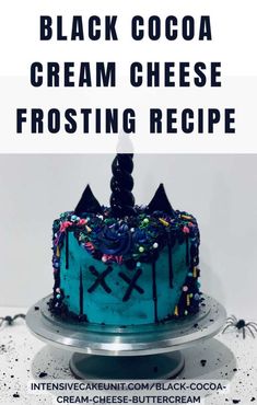 a blue frosted cake sitting on top of a white plate with the words black cocoa cream cheese frosting recipe