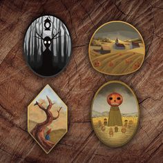 four buttons with pictures of pumpkins and trees in the background on wood paneled surface