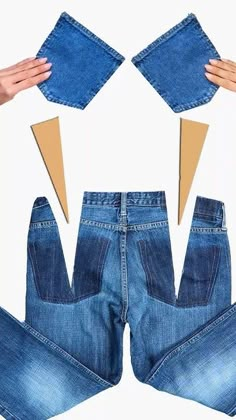 the jeans are cut out and placed on top of each other to make an origami