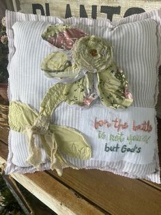 a decorative pillow made to look like a dragon on a bench with the words happy birthday, but god's