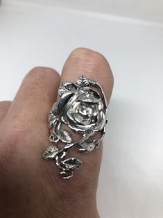 Lovely and delicate Rose flower ring 925 Sterling silver with black rhodium Size 6 or 9 or 10 can be re sized for you on request. My jeweler charges $10 All rings are shipped in a nice gift box. Check out our over a THOUSAND great reviews Engraving is $4 per letter and is not always perfect depending on the piece. It can take a few days if the jeweler is busy. This is payable to Paypal Judithsltd@gmail.com Elegant Silver Rings With Rose Design, Elegant Silver Rings With Rose Details, Silver Rose Design Ring, Silver Ring With Rose Design, Silver Rose Ring Jewelry, Silver Flower-shaped Rings With Rose Design, Silver Flower Ring With Roses For Gift, Silver Promise Ring With Roses Detail, Silver Rose Design Jewelry For Promise Ring