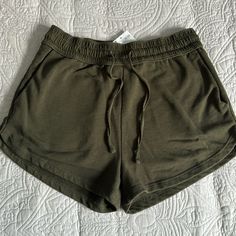 Brand H&M Color Army Green Size Small Condition Nwt Material Is Thick Like Sweatpants. Has Two Pockets. Length Is Short And Has Drawstrings H&m Short Bottoms With Elastic Waistband, H&m Elastic Waistband Short Bottoms, H&m Shorts With Elastic Waistband, H&m Casual Shorts With Built-in Shorts, H&m Casual Shorts With Elastic Waistband, H&m Stretch Shorts, H&m Cotton Stretch Bottoms, H&m Stretch Cotton Bottoms, H&m Casual Bottoms With Built-in Shorts