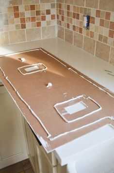 a kitchen counter is being constructed with tile