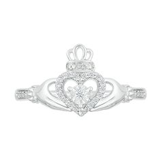 a white gold ring with a heart and crown on the front, surrounded by diamonds