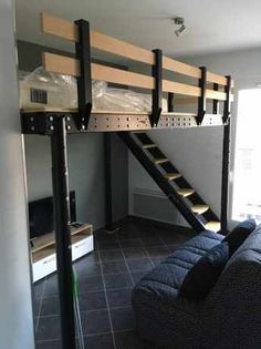 a loft bed with a couch underneath it