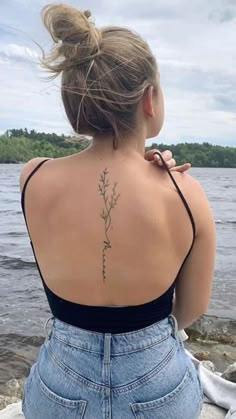 a woman with a tattoo on her back