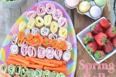 an assortment of food is displayed on a plate with the words spring rolls and easter treats