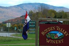 the sign for boden valley winery in front of mountains