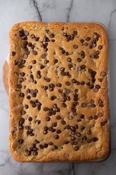 a square cookie with chocolate chips on top