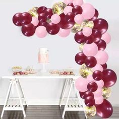 the balloon arch is decorated with pink, red and gold balloons for an elegant party