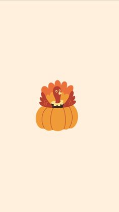 a turkey sitting on top of a pumpkin