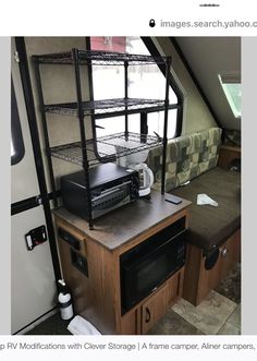 an rv kitchen with microwave, toaster and oven