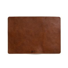 a brown leather place mat on a white background