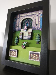 a shadow box with an image of a castle in the middle and trees around it