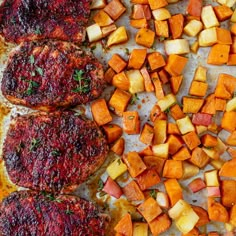 some meat and vegetables on a sheet of baking paper with seasoning sprinkled over them