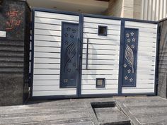 an entrance to a building with decorative designs on the door and side panels, along with steps