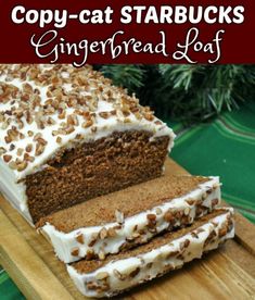 a loaf of carrot cake sitting on top of a wooden cutting board