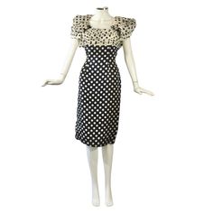 Introducing The Epitome Of Luxe 1980s With This Eugene Alexander Petal Sleeves Polka Dot Cocktail Dress. This Vintage Couture Piece Exudes Elegance With Its Navy Damask Fabric And "Blossoming" Floral Off-Shoulder Sleeves In A Delicate Navy Polka Dot On A Light Cream Chiffon. They Add A Touch Of Whimsy, While The Costume Gemstone Accent At The Dcolletage Brings A Hint Of Glamour. This Stunning Cocktail Dress Is In Pristine Condition, Making It A Rare Find For Any Vintage Fashion Enthusiast. Label Reads Size 8 (Vintage) Measurements Length: 42.5 Inches || Chest: 17 Inches Flat || Waist: 15.25 Inches Flat || Hips: 18.5 Inches Flat Condition Report Dress Is In Very Good Condition, Showi Petal Sleeves, Damask Fabric, Petal Sleeve, Fashion Enthusiast, Vintage Couture, Light Cream, Blue Cream, Shoulder Sleeve, Polka Dot