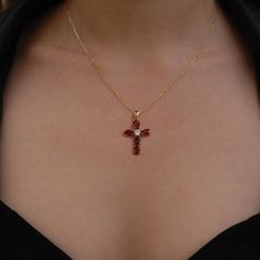 "This garnet cross necklace is a beautiful and meaningful piece for those who practice Christianity. The solid gold pendant features a small, elegant cross adorned with a sparkling garnet gemstone. The necklace is a minimalist and modern design, making it suitable for everyday wear. The garnet, a deep red stone, adds a pop of color to the necklace. The rich red hue of the pendant captures the festive spirit of the holiday season, making it a perfect symbol of love and celebration to share with your special someone during Christmas. PRODUCT DETAILS: * Material: 14K Solid Gold (real solid gold, no gold-filled or no gold plated material) * Choice of Gold Color: Yellow Gold, Rose Gold, White Gold * Adjustable gold extension chain * Closure: Spring ring * Chain style: Cable * Style: Minimalist Stone Cross Necklace, Ruby Cross Pendant, Christian Cross Necklace Aesthetic, Red Stone Jewellery, Cross Necklace Aesthetic, Cross Necklace Womens, Red Cross Necklace, Garnet Necklace Gold, Cross Pendant Necklace Woman