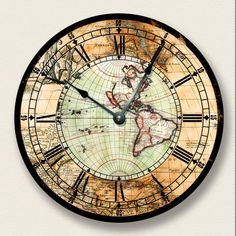 a clock with an old world map on it's face and numbers in the middle